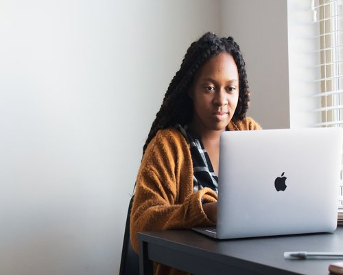 Person taking a quick pause at a laptop desk